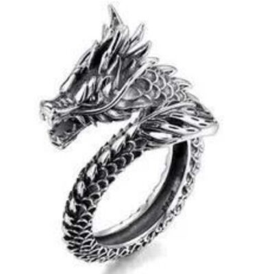Close-up of a silver-plated ring designed as a detailed dragon wrapping around the finger.